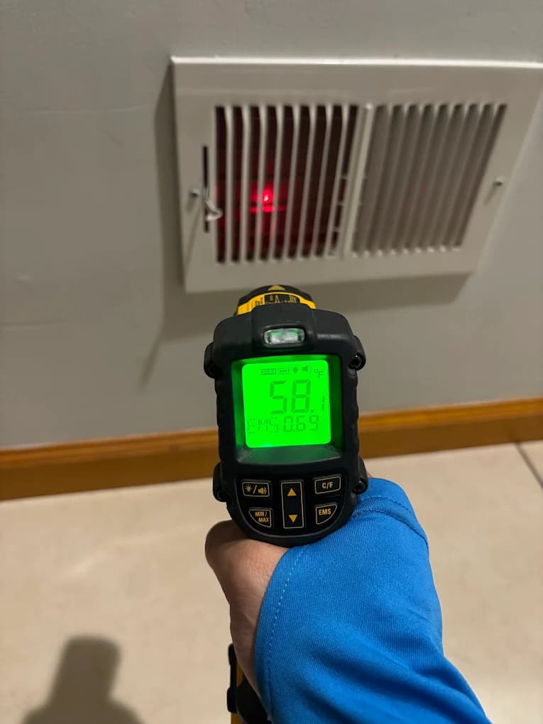 HVAC technician inspecting and identifying system problems with diagnostic tools
